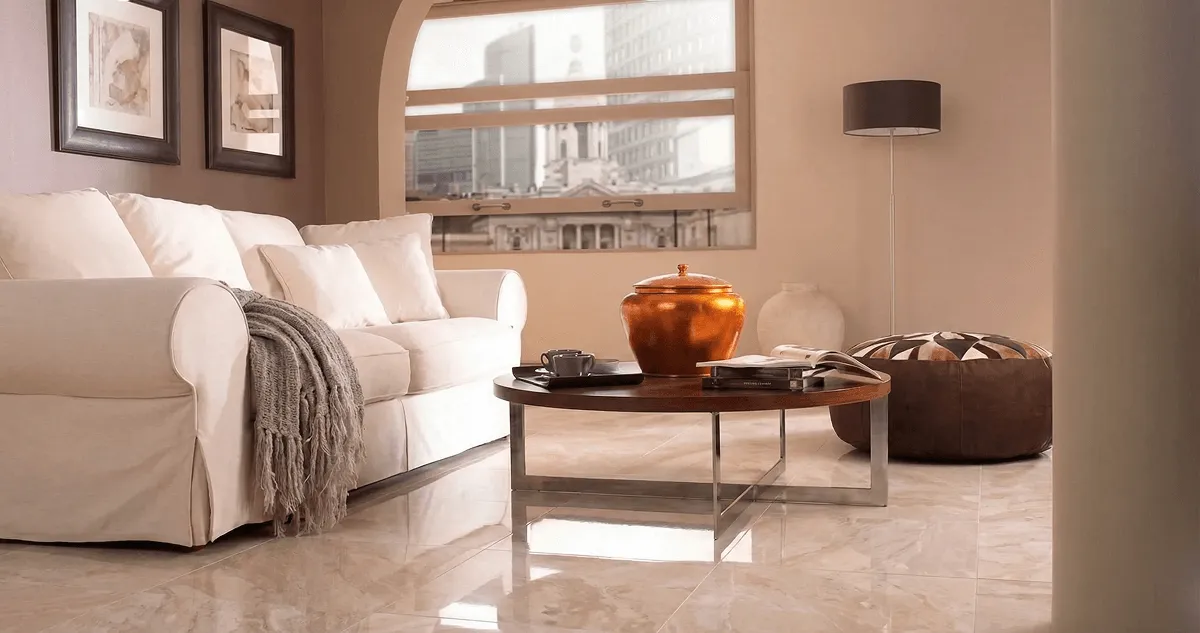Modern living room with professionally installed marble flooring, a beige sofa, coffee table in Bradenton, FL